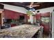 Spacious kitchen featuring granite countertops, wood cabinets, and stainless steel appliances at 5144 Cedarbrook Ln, Hernando Beach, FL 34607