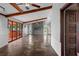 Open living room with stone fireplace and sliding glass doors to patio at 5144 Cedarbrook Ln, Hernando Beach, FL 34607