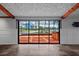 Spacious living room with large sliding glass doors overlooking waterfront view at 5144 Cedarbrook Ln, Hernando Beach, FL 34607
