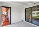 Covered patio with tile flooring and sliding glass doors leading to the indoors at 5144 Cedarbrook Ln, Hernando Beach, FL 34607