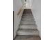 Carpeted staircase leading to the upper level of the home at 5144 Cedarbrook Ln, Hernando Beach, FL 34607