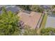 Aerial view showcasing the home's roof, landscaping, and neighboring homes with pools at 5317 Pagnotta Pl, Lutz, FL 33558