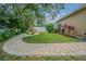 A winding brick walkway and lush landscaping enhance this home's well maintained backyard at 5317 Pagnotta Pl, Lutz, FL 33558