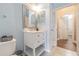 Bathroom showcasing vanity with a sink, silver-framed mirror, and neutral walls at 5317 Pagnotta Pl, Lutz, FL 33558