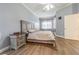 Cozy bedroom with neutral colors, a comfortable bed, and natural light at 5317 Pagnotta Pl, Lutz, FL 33558