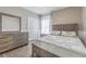 Cozy bedroom featuring wood-look floors, a rustic wood bed frame, and matching dresser at 5317 Pagnotta Pl, Lutz, FL 33558