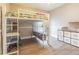 bedroom featuring a bunk bed, desk, and storage shelves at 5317 Pagnotta Pl, Lutz, FL 33558
