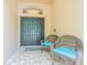 Inviting front porch featuring double doors and comfortable seating at 5317 Pagnotta Pl, Lutz, FL 33558