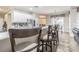 Kitchen island with bar seating overlooking dining area, perfect for entertaining guests at 5317 Pagnotta Pl, Lutz, FL 33558