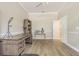 Well-lit office with wood-look tile flooring and desk at 5317 Pagnotta Pl, Lutz, FL 33558