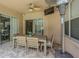 Outdoor patio featuring a dining table and chairs under a covered area with brick flooring at 5317 Pagnotta Pl, Lutz, FL 33558