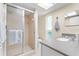 Cozy bathroom with tiled shower, neutral tones, and bright lighting at 535 Sandy Hook, Palm Harbor, FL 34683