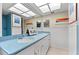 Spacious bathroom with double sinks, bright lighting, and ample counter space at 535 Sandy Hook, Palm Harbor, FL 34683