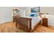Comfortable bedroom with wood floors, matching bedside tables and natural light at 535 Sandy Hook, Palm Harbor, FL 34683
