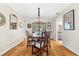Cozy dining room with chandelier lighting and seamless access to the living area and backyard views at 535 Sandy Hook, Palm Harbor, FL 34683