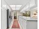 Well-lit kitchen showcasing full-size appliances, breakfast nook, and tile flooring at 535 Sandy Hook, Palm Harbor, FL 34683