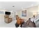 Inviting living area with recliner chairs, wooden accents, and a large screen television at 535 Sandy Hook, Palm Harbor, FL 34683