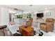 Open-concept layout connecting the living room, kitchen and dining area at 535 Sandy Hook, Palm Harbor, FL 34683