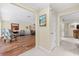 Inviting open-concept living room with hardwood floors, connecting to the dining room and other living spaces at 535 Sandy Hook, Palm Harbor, FL 34683