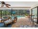 Inviting screened patio with comfortable seating, a ceiling fan, and views of the sparkling pool at 535 Sandy Hook, Palm Harbor, FL 34683