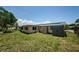 Spacious backyard with a storage shed and green grass at 6111 2Nd Ave, New Port Richey, FL 34653