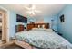 Comfortable main bedroom featuring a ceiling fan, a dresser, and a large bed at 6111 2Nd Ave, New Port Richey, FL 34653