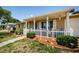 Charming single-story home with a quaint front porch and white picket fence at 6111 2Nd Ave, New Port Richey, FL 34653