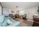 Comfortable living room with plenty of natural light and access to the front door at 6111 2Nd Ave, New Port Richey, FL 34653