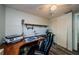 Bright home office space featuring wood floors, a built in desk, and additional storage at 6111 2Nd Ave, New Port Richey, FL 34653