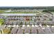 Overhead view of a residential neighborhood, highlighting the property's location near a pond at 7225 Ronnie Gardens Ct, Tampa, FL 33619