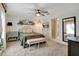 Cozy bedroom with a ceiling fan, stylish decor, and a comfortable bed, providing a relaxing retreat at 7225 Ronnie Gardens Ct, Tampa, FL 33619