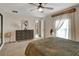 Serene bedroom featuring a large window, ample natural light, and comfortable furniture, creating a peaceful sanctuary at 7225 Ronnie Gardens Ct, Tampa, FL 33619
