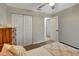 Bedroom featuring a large closet and modern décor, with neutral colored walls at 7225 Ronnie Gardens Ct, Tampa, FL 33619