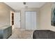Bedroom featuring a large closet and modern décor, with neutral colored walls at 7225 Ronnie Gardens Ct, Tampa, FL 33619
