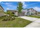 Beautiful home with a well-manicured lawn, two-car garage, and inviting curb appeal in a Gathering-friendly neighborhood at 7225 Ronnie Gardens Ct, Tampa, FL 33619