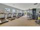 Well-equipped gym with modern treadmills, elliptical machines, and free weights, all within a bright and spacious workout area at 7225 Ronnie Gardens Ct, Tampa, FL 33619