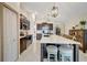 Well-equipped kitchen with island seating, stainless appliances, and dark cabinets with tile flooring at 7225 Ronnie Gardens Ct, Tampa, FL 33619