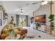Bright living room with a decorative brick wall, cozy seating, and a sliding glass door, perfect for relaxation at 7225 Ronnie Gardens Ct, Tampa, FL 33619