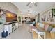 Spacious open-concept living area with a decorative brick wall and stylish furnishings, creating a comfortable and inviting atmosphere at 7225 Ronnie Gardens Ct, Tampa, FL 33619
