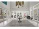 Bright lobby features tile floors, modern lighting, and glass doors, offering an inviting entrance at 7225 Ronnie Gardens Ct, Tampa, FL 33619