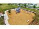Bright playground with swings, slides, and climbing structures, set in a safe, wood-chip-covered play area at 7225 Ronnie Gardens Ct, Tampa, FL 33619