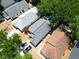 Aerial shot of the home's backyard, showcasing a new roof, manicured lawn, and nearby pool at 759 Cape Cod Cir, Valrico, FL 33594