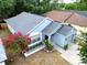 An aerial shot captures the single-story home with gray roof and landscaped front yard at 759 Cape Cod Cir, Valrico, FL 33594