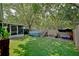 Spacious backyard with a well-maintained artificial lawn, pool, and screened porch at 759 Cape Cod Cir, Valrico, FL 33594