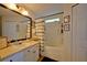 Well-maintained bathroom featuring a vanity, bathtub with shower, and neutral decor, providing a clean and functional space at 759 Cape Cod Cir, Valrico, FL 33594