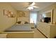 Well-lit bedroom featuring a bed, dresser, and soft lighting, providing a comfortable and relaxing atmosphere at 759 Cape Cod Cir, Valrico, FL 33594