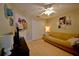 A clean bedroom with tiled floor, ceiling fan, and cozy furniture at 759 Cape Cod Cir, Valrico, FL 33594