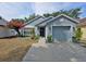 Charming single-story home featuring a beautiful flower tree, attached garage, and a welcoming front door with a wreath at 759 Cape Cod Cir, Valrico, FL 33594