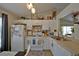 Bright kitchen with white cabinets, modern appliances, and a cozy breakfast area at 759 Cape Cod Cir, Valrico, FL 33594