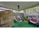 Charming covered patio with comfortable seating, plants, and a tranquil setting at 759 Cape Cod Cir, Valrico, FL 33594